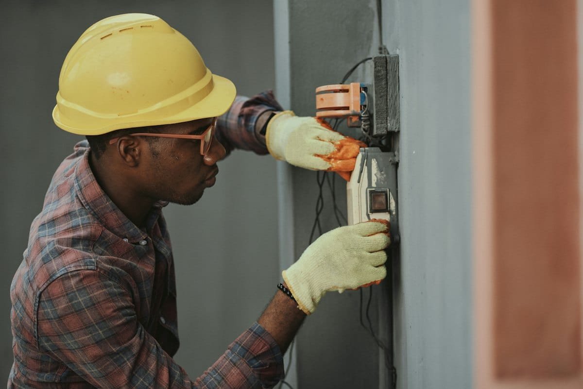 Electrician working on an electrical panel